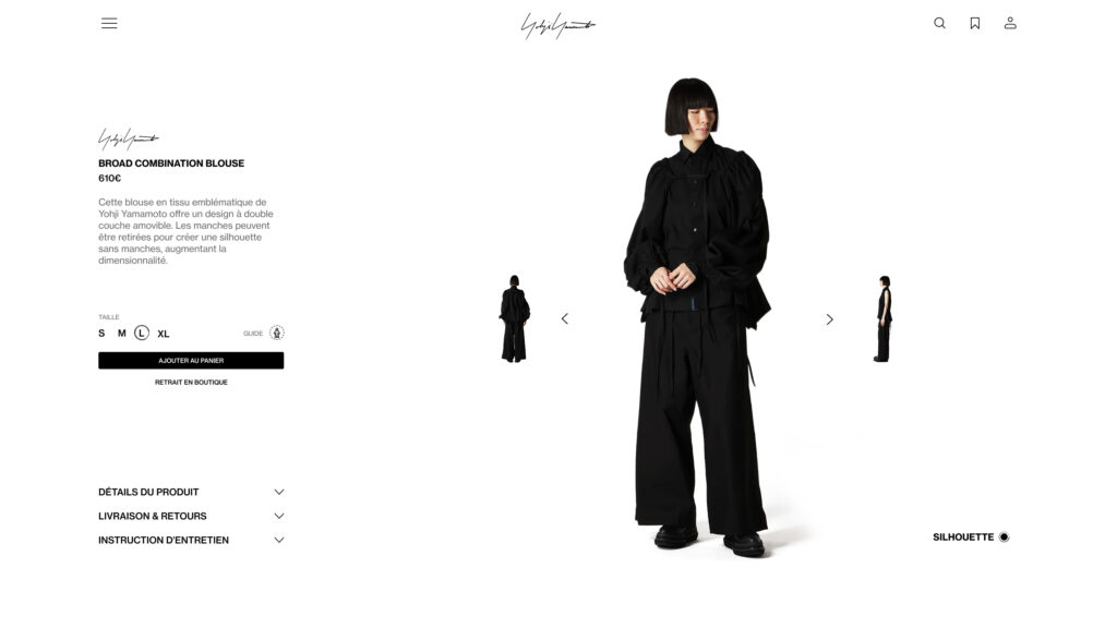 Mannequin portant la blouse Broad Combination noire de Yohji Yamamoto avec un pantalon large assorti.